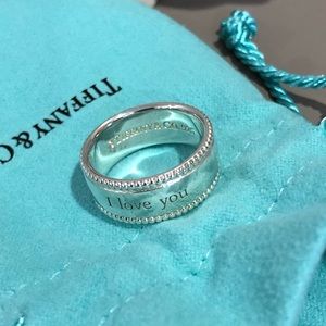 Tiffany & Co “I love you” notes milgrain cigar band ring. Size 7